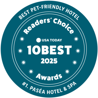 A teal badge featuring "Best Pet-Friendly Hotel," "Readers' Choice," and "#1. Paséa Hotel & Spa," highlighting the 2025 awards.