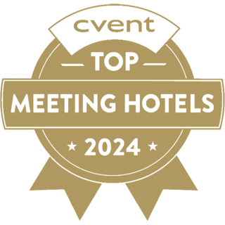 Gold badge featuring "cvent TOP MEETING HOTELS 2024," highlighting recognition for outstanding meeting venues.